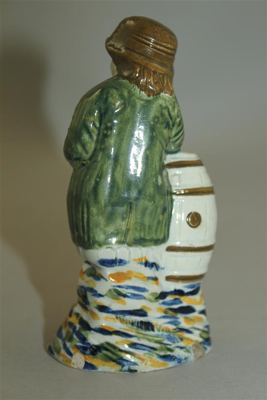 A Prattware figure of a young boy leaning on a barrel, late 18th century, 11.8cm